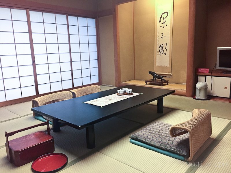 Ryokan in Hakone - multi-purpose room. TV, living, dining, and recreation room all rolled in to one.