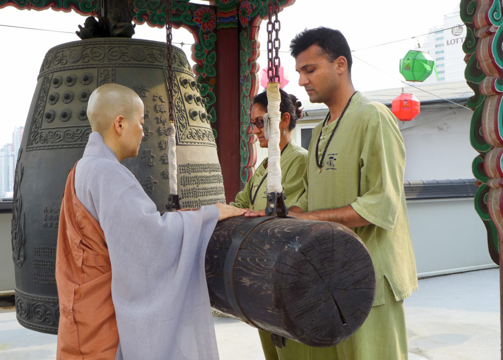 Striking the temple gong with the head priest